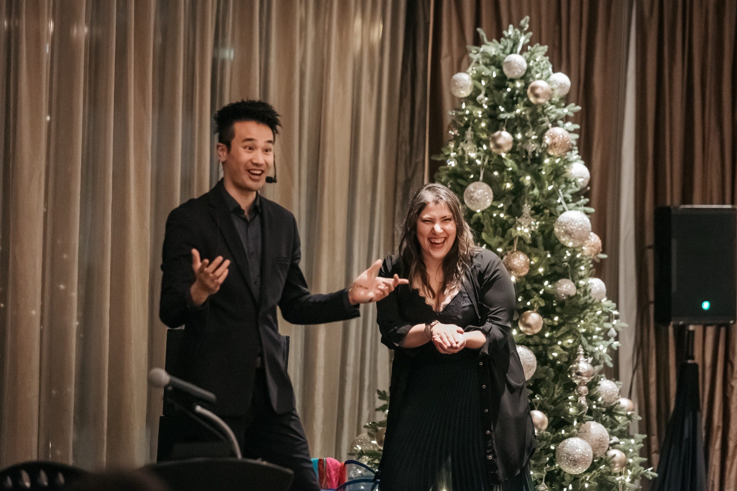 Kel performing mentalism with a guest at a corporate holiday party in Vancouver