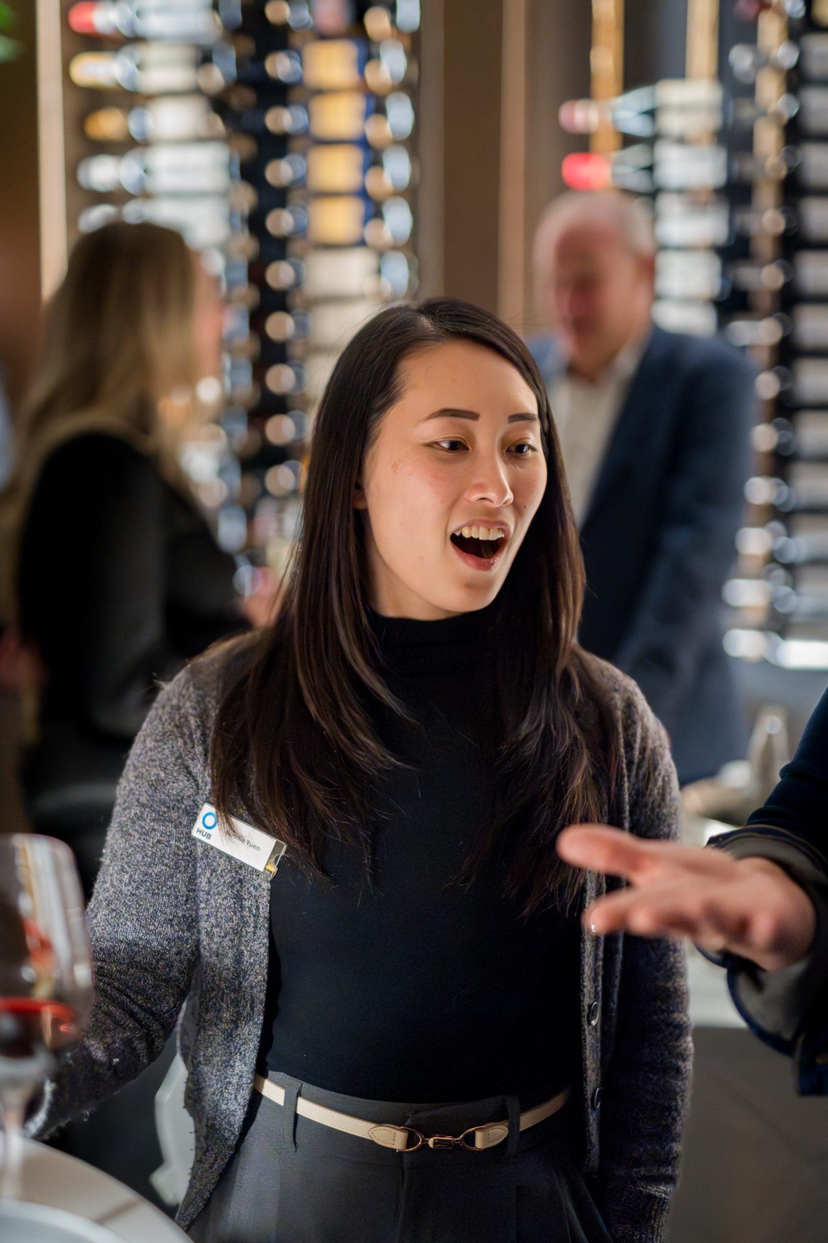 A guest caught mid-gasp during close-up magic at a private event space