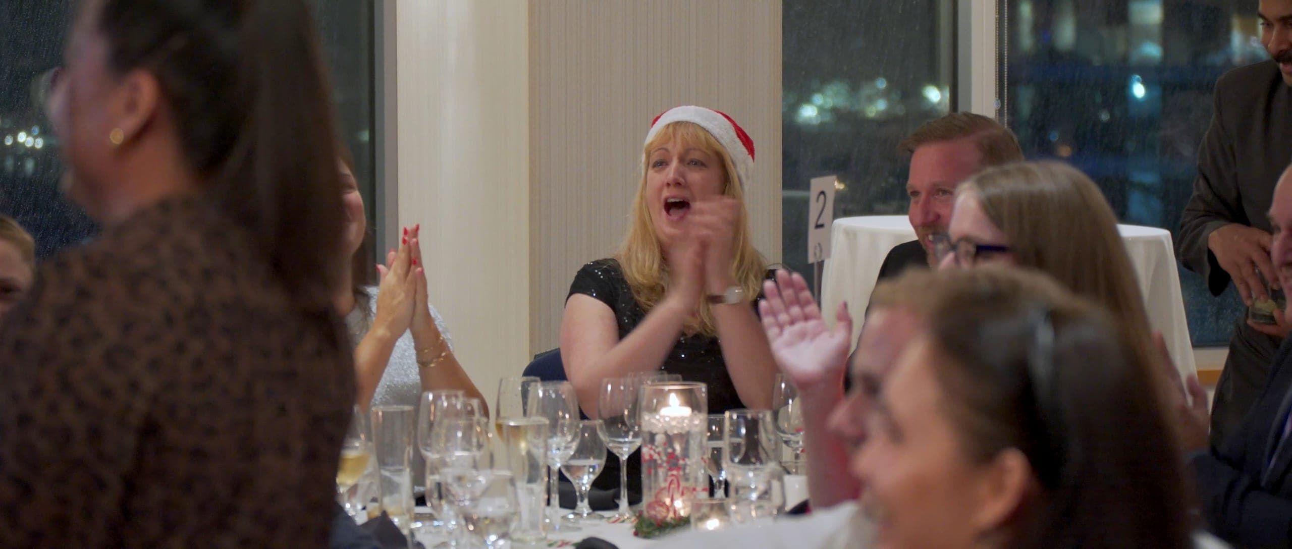 A full dinner audience applauding during the after-dinner show at a Vancouver resource industry event