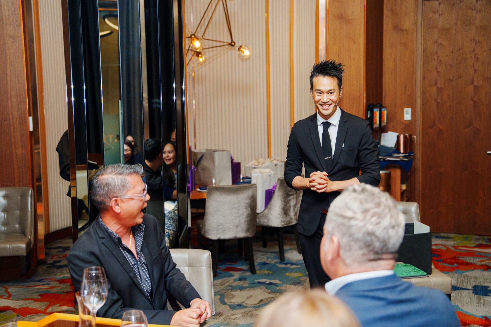 BCLC VIP guests laughing during Kel's feature show at Grand Villa Casino in Burnaby
