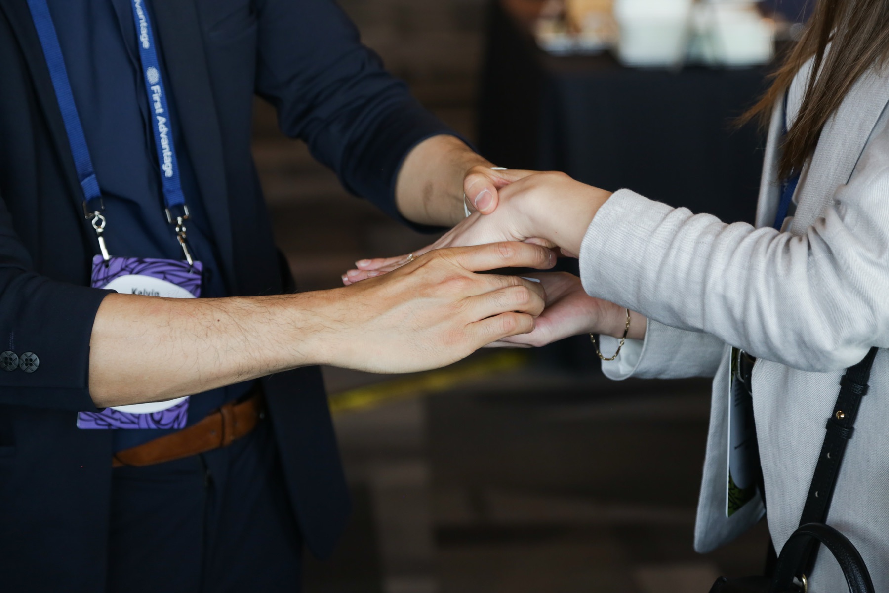 Close-up magic performed hand to hand with a delegate on the trade show floor at a Vancouver conference
