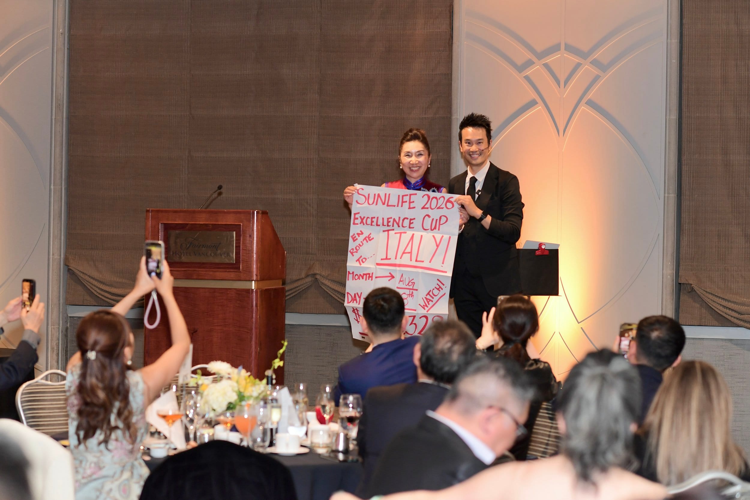 Corporate magician and MC Kelvin Ng performing stage magic show for 120 guests at Sun Life Financial awards night Fairmont Hotel Vancouver